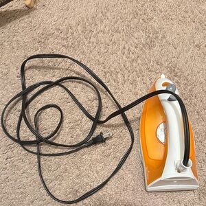 Rival Orange and White Handheld Iron